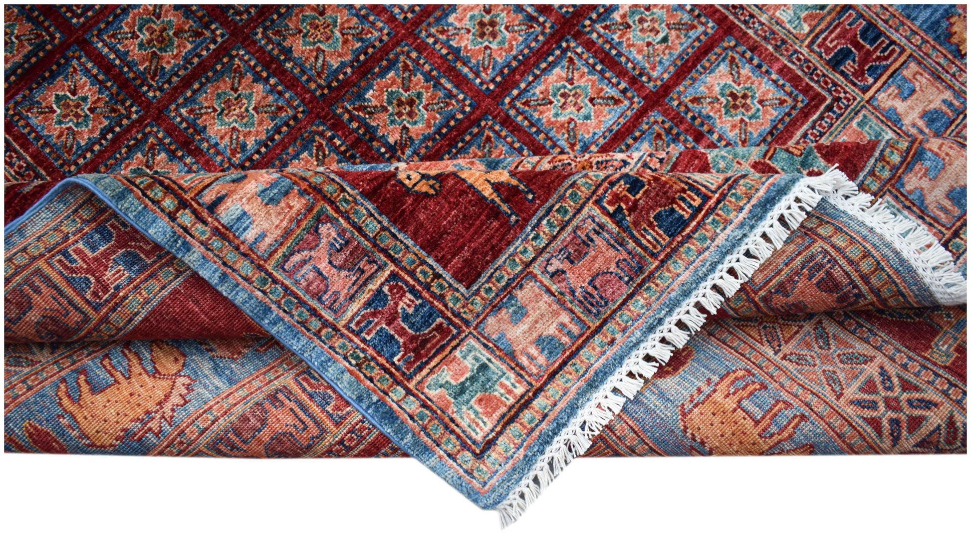 A handwoven Afghan Chobi rug featuring a geometric diamond pattern and a decorative animal border.