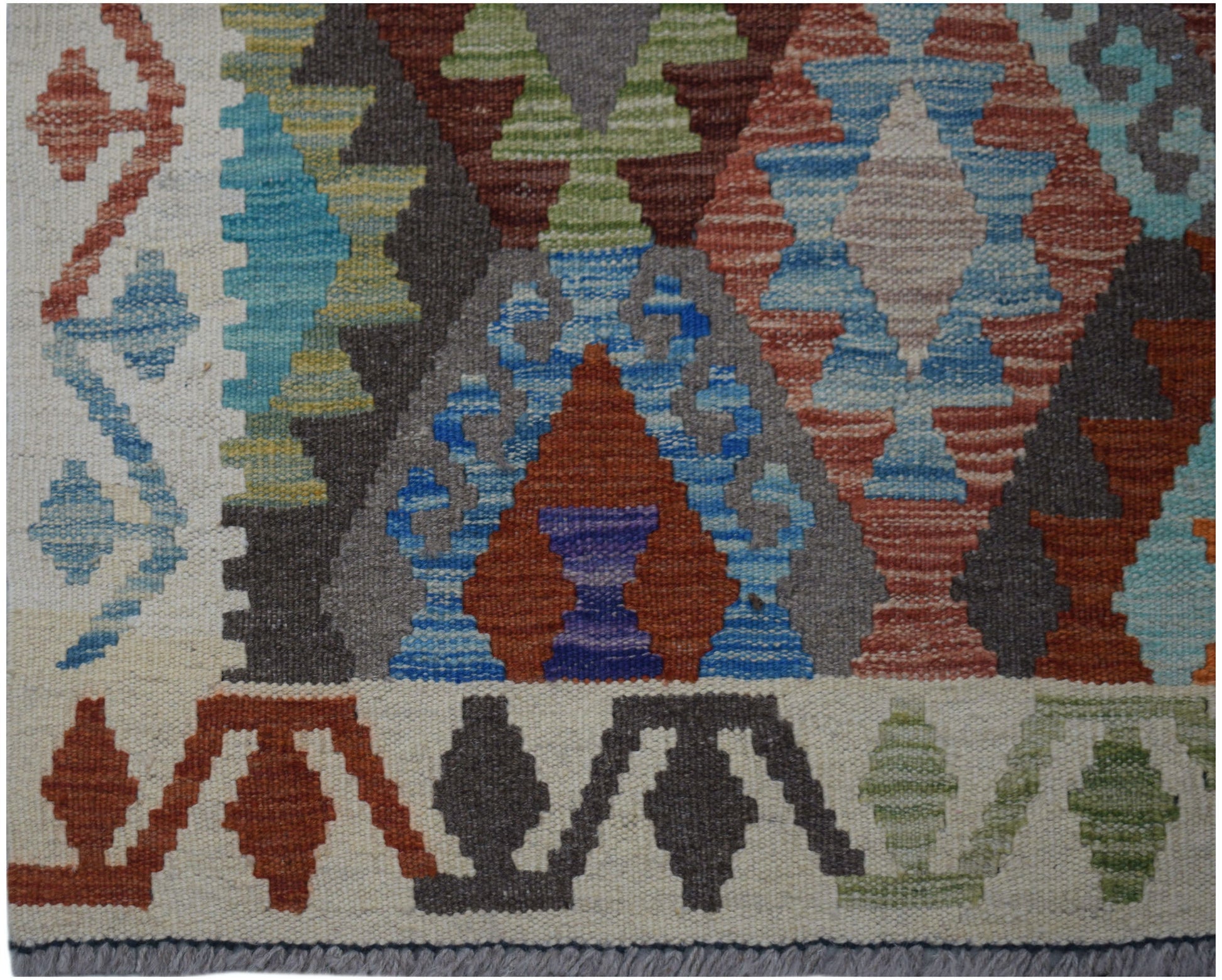 Handwoven Afghan Maimana kilim runner featuring a geometric pattern in vibrant multicolored wool.