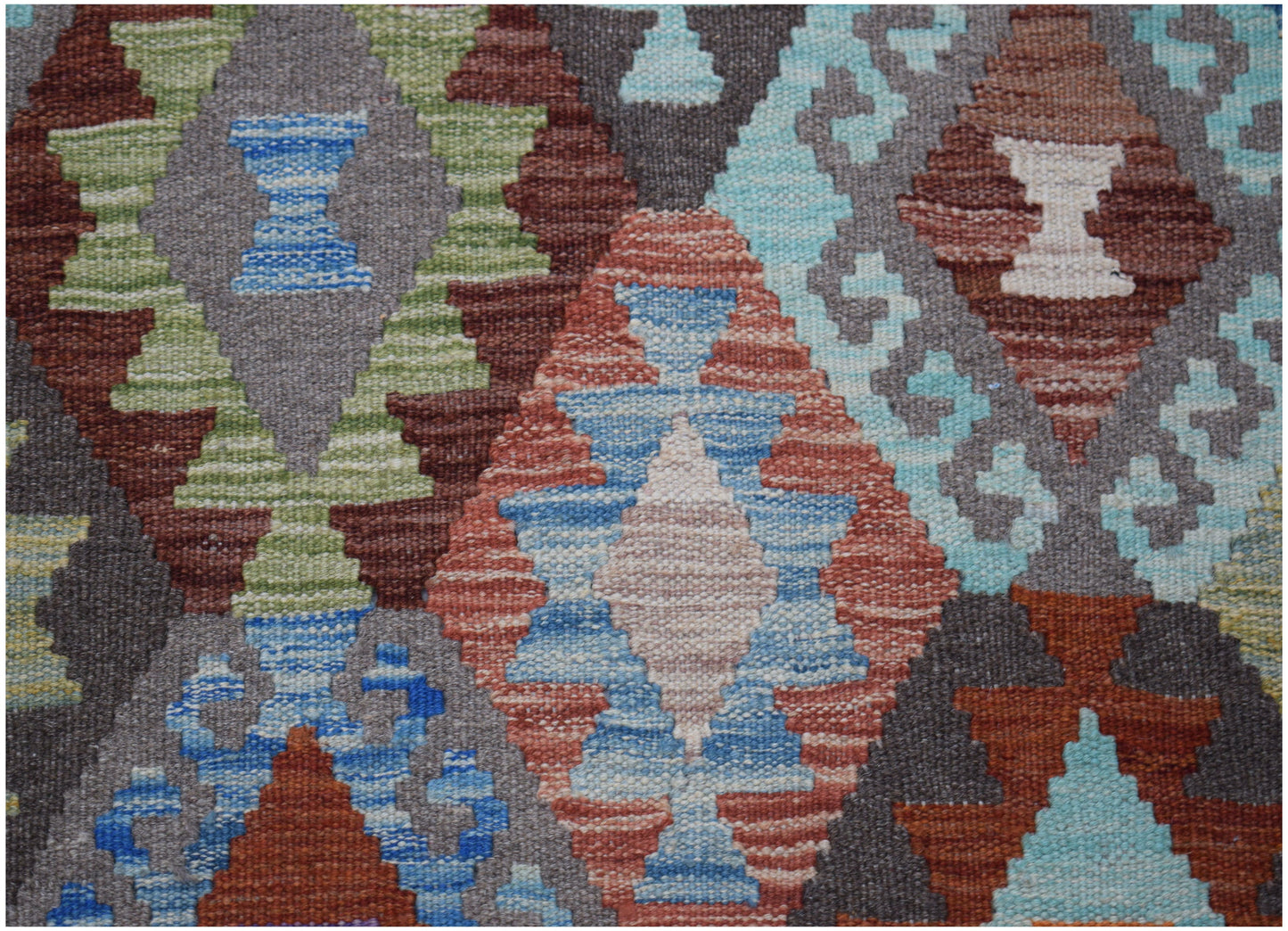 Handwoven Afghan Maimana kilim runner featuring a geometric diamond pattern in multicolored wool.