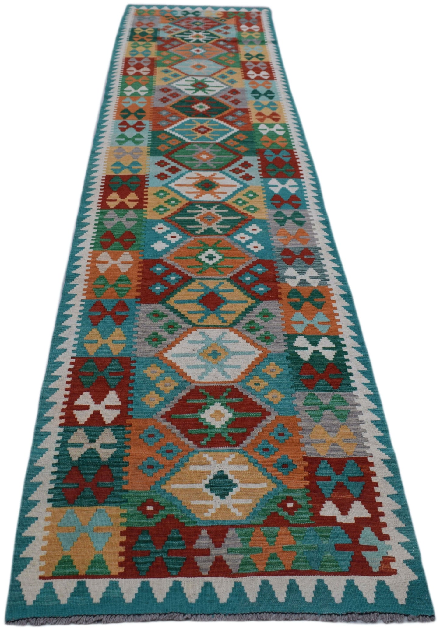 A handmade Afghan Maimana kilim runner featuring a vibrant geometric pattern in wool.