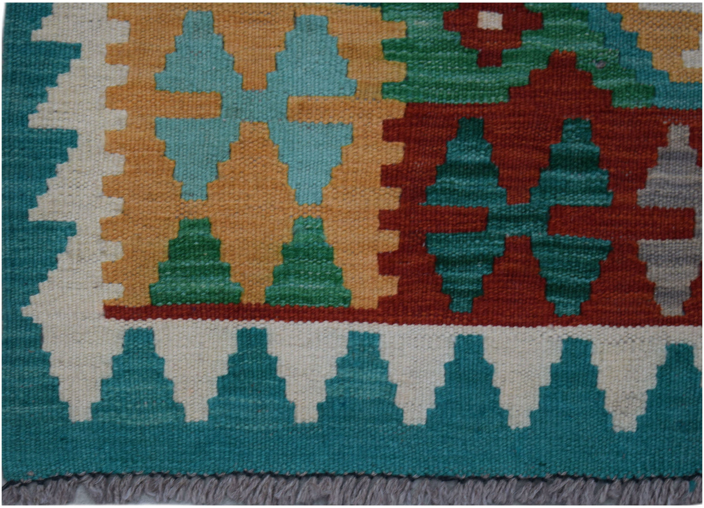 Handwoven Afghan Maimana wool runner featuring a geometric pattern in teal, red, and gold.