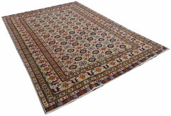 A hand-knotted Afghan Bashiri rug featuring a repeating geometric floral pattern in silk and wool.