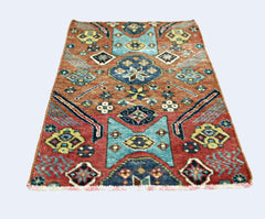 A rectangular vintage Persian rug featuring geometric patterns in red, blue, and yellow tones.