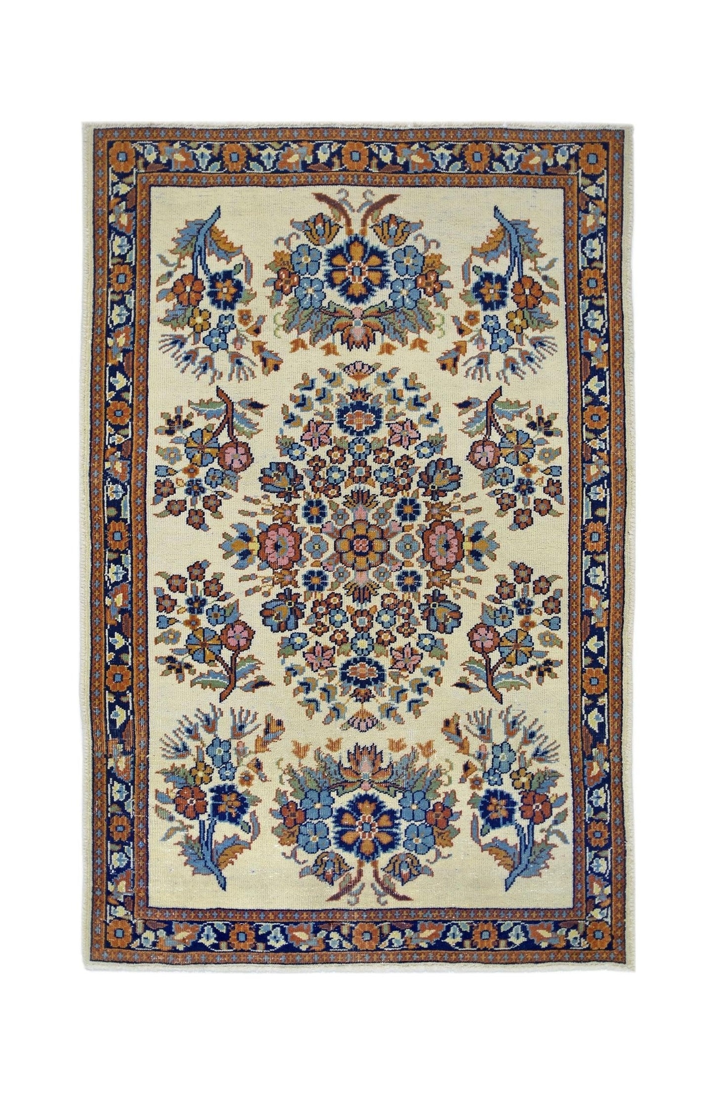 A vintage Persian Sarouk rug featuring a central floral medallion on a cream field.