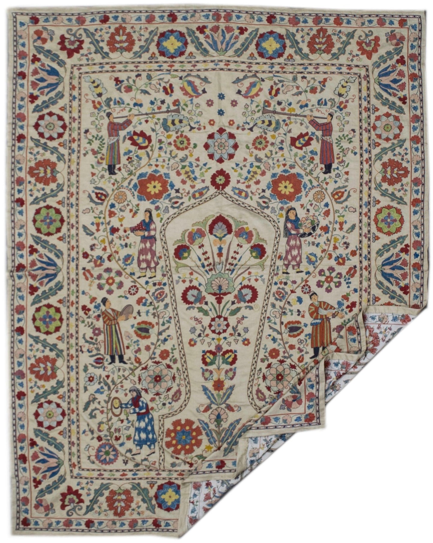 Handmade silk Uzbek suzani featuring intricate floral embroidery and figures on a cream background.