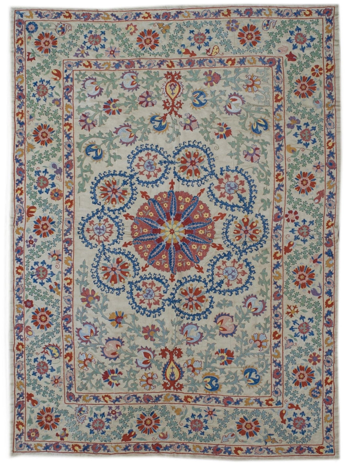 Handmade Uzbek suzani featuring intricate silk floral embroidery on a cream silk fabric base.