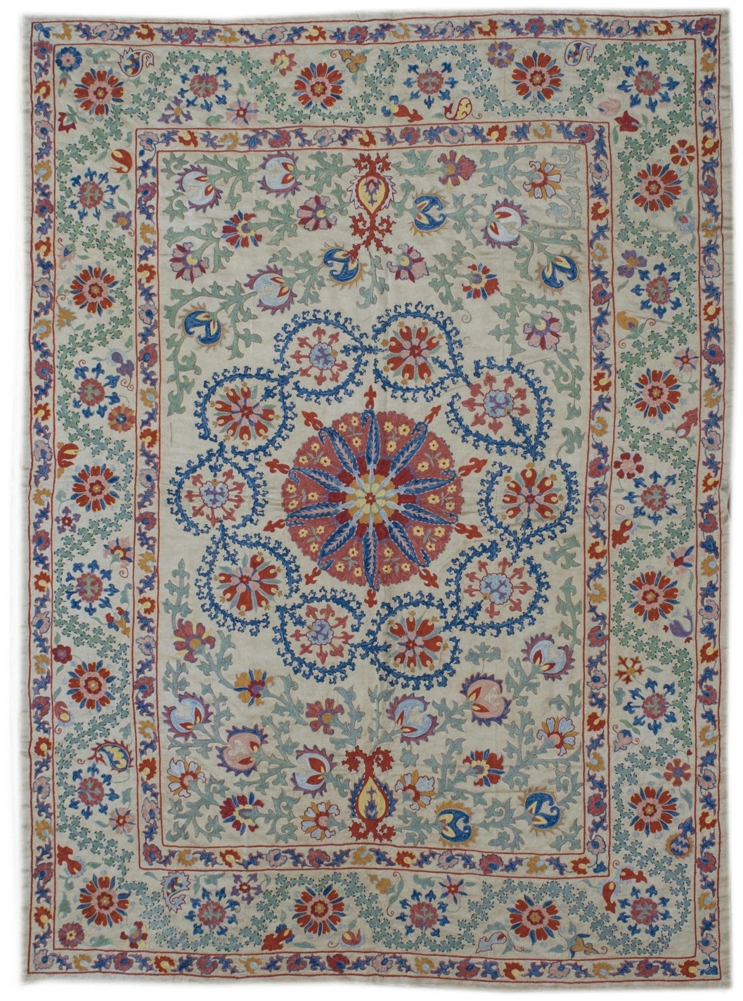 Handmade Uzbek suzani featuring intricate silk floral embroidery on a cream silk fabric base.
