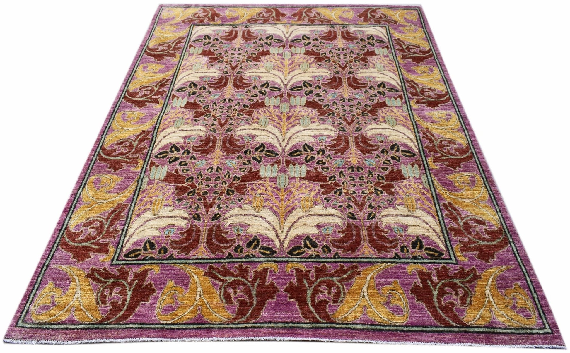 A handwoven Afghan wool rug featuring a floral botanical pattern in purple, gold, and red tones.