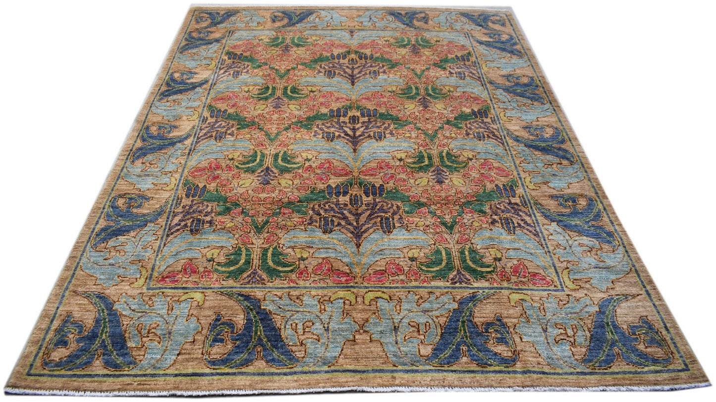 A handwoven Afghan rug featuring a botanical floral pattern in blue, green, and pink on a tan base.