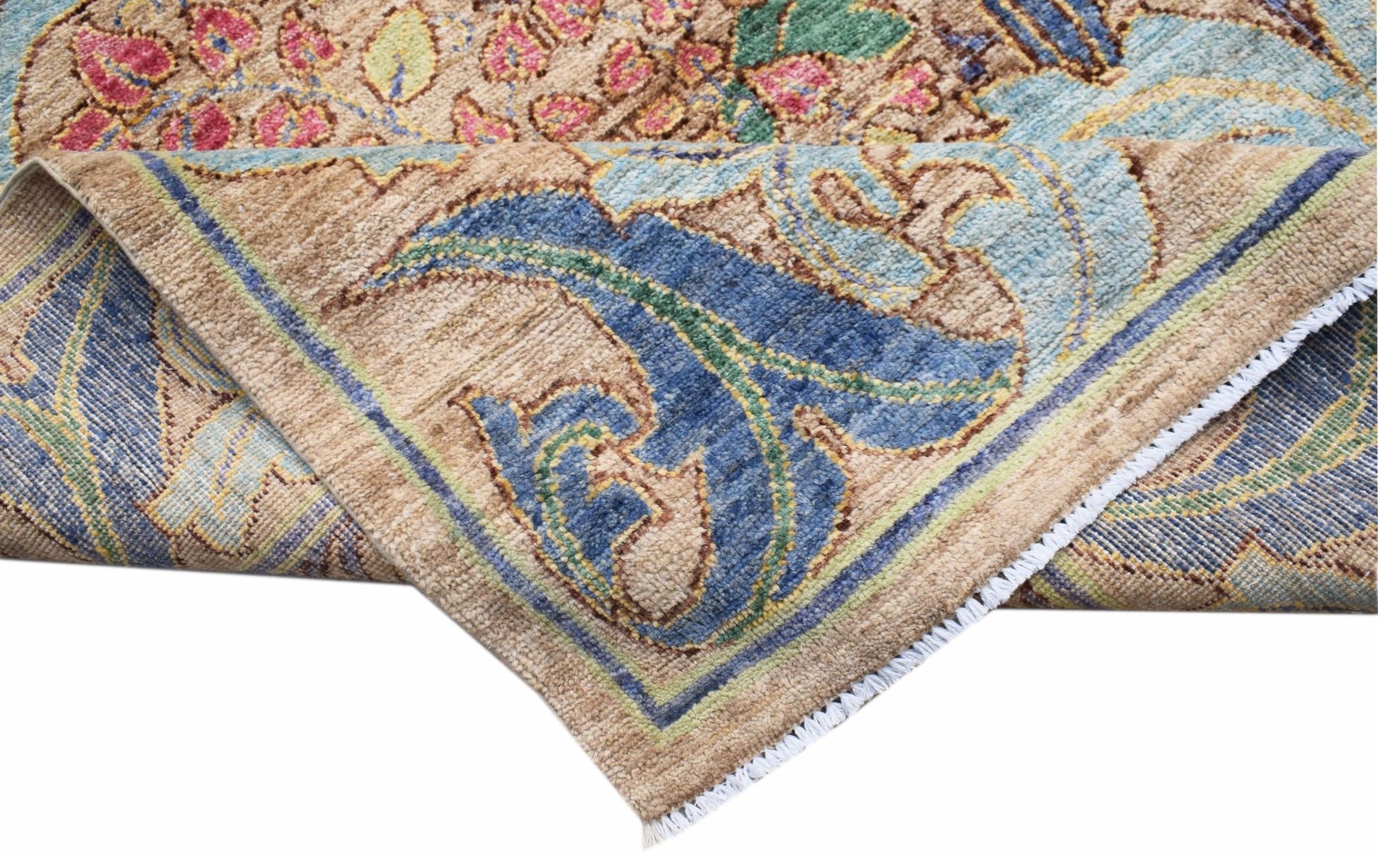 A handwoven Afghan wool rug featuring a floral botanical pattern in blue, pink, and tan tones.