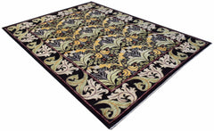 A rectangular handwoven Afghan rug featuring a botanical floral pattern in green, gold, and black.