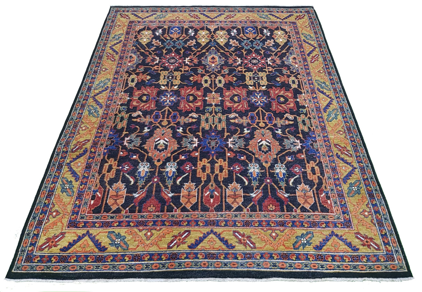 A hand-knotted Afghan rug featuring a dark blue field with intricate floral and medallion patterns.