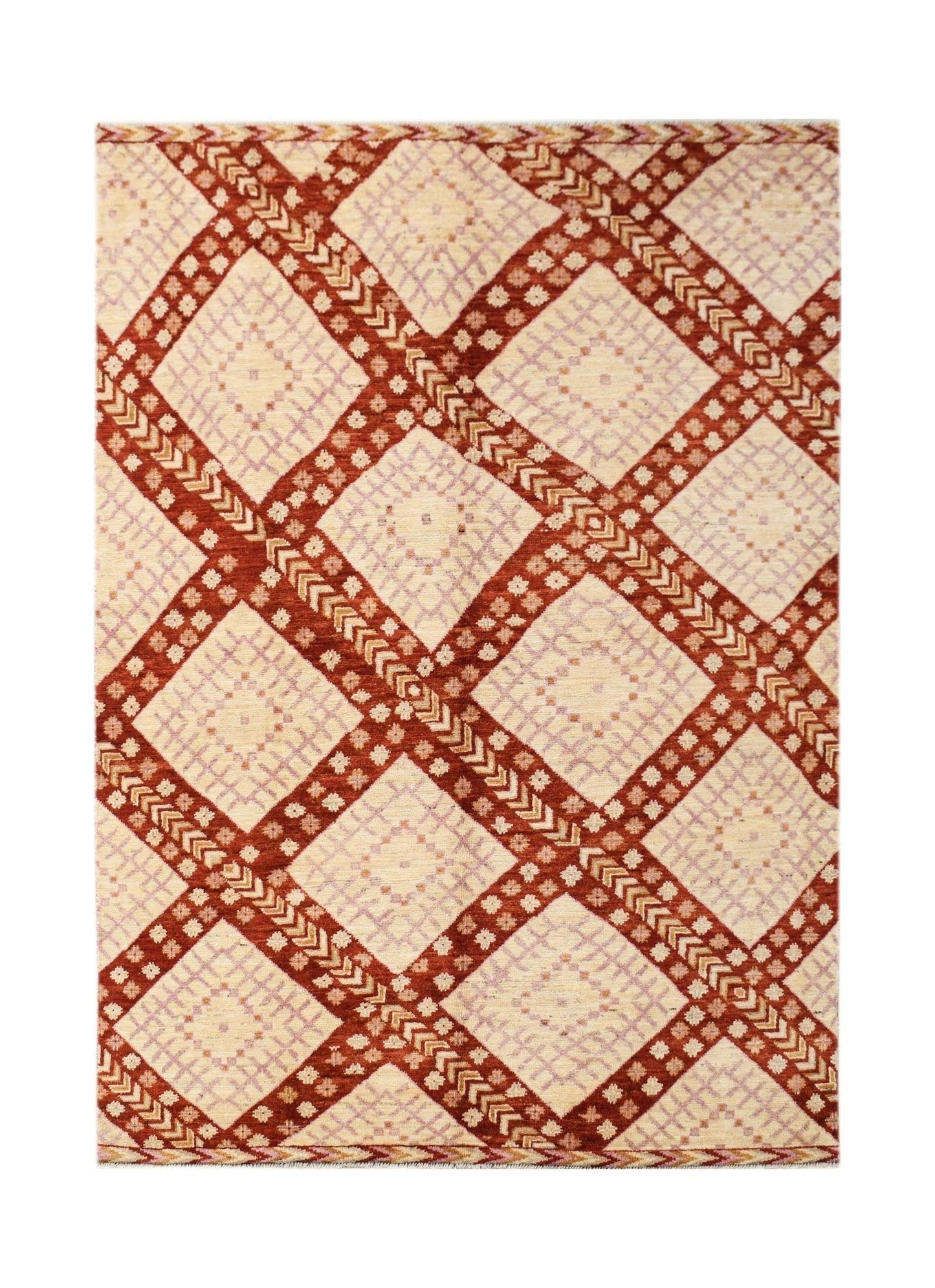 A handknotted wool rug featuring a geometric diamond pattern in rust red and cream tones.