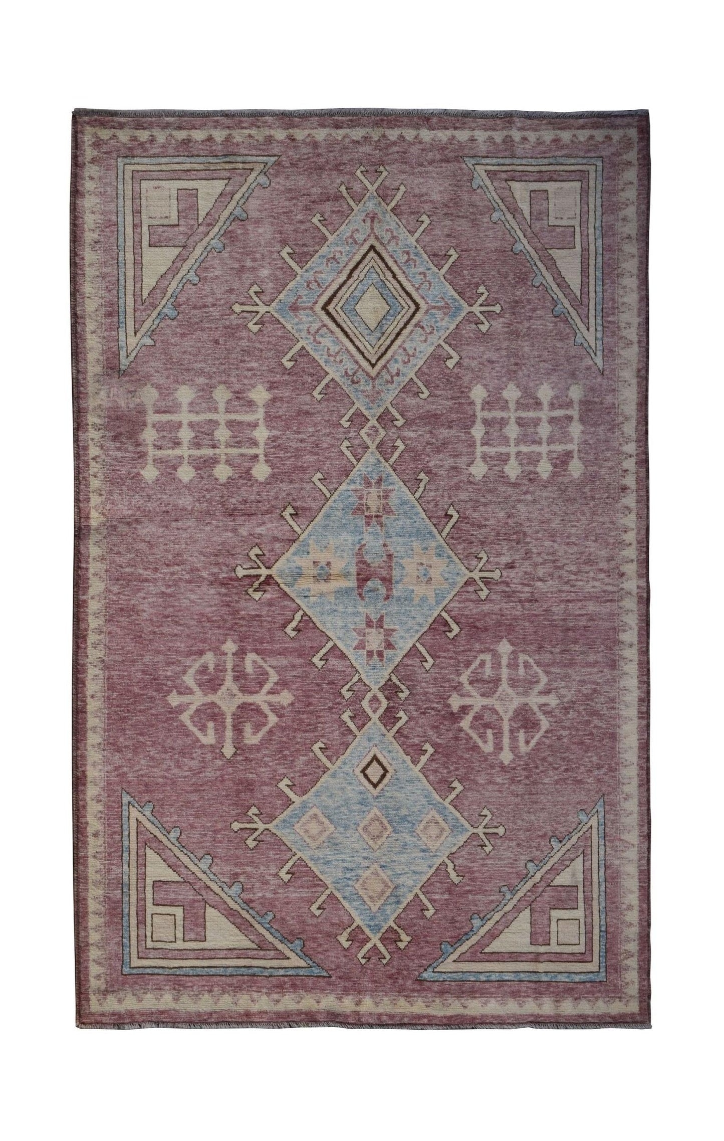 A handmade Afghan wool rug featuring a geometric diamond pattern in muted red and blue tones.