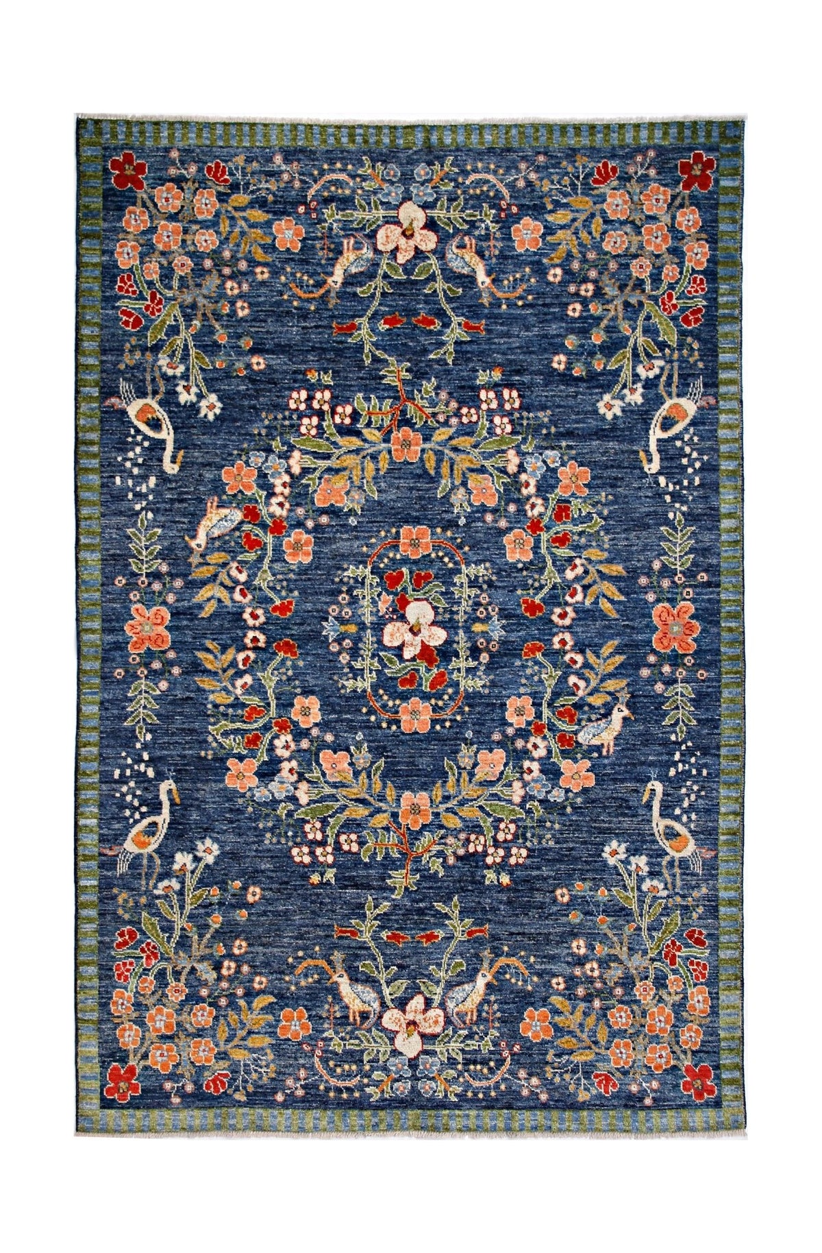 Handmade wool rug featuring a floral and bird pattern in orange and red on a blue background.