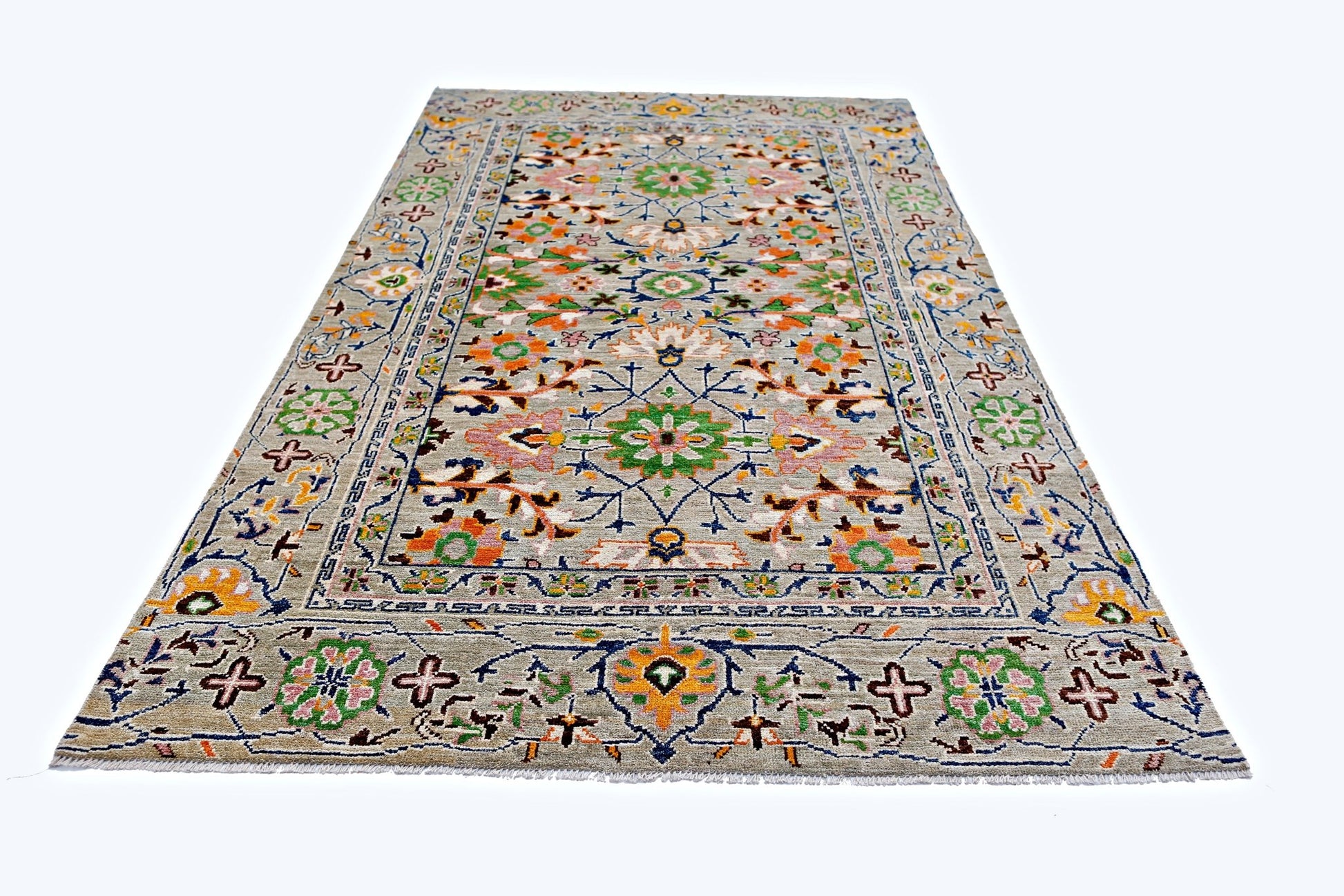 A handmade transitional Kohi rug from Afghanistan featuring a colorful floral pattern on a grey field.
