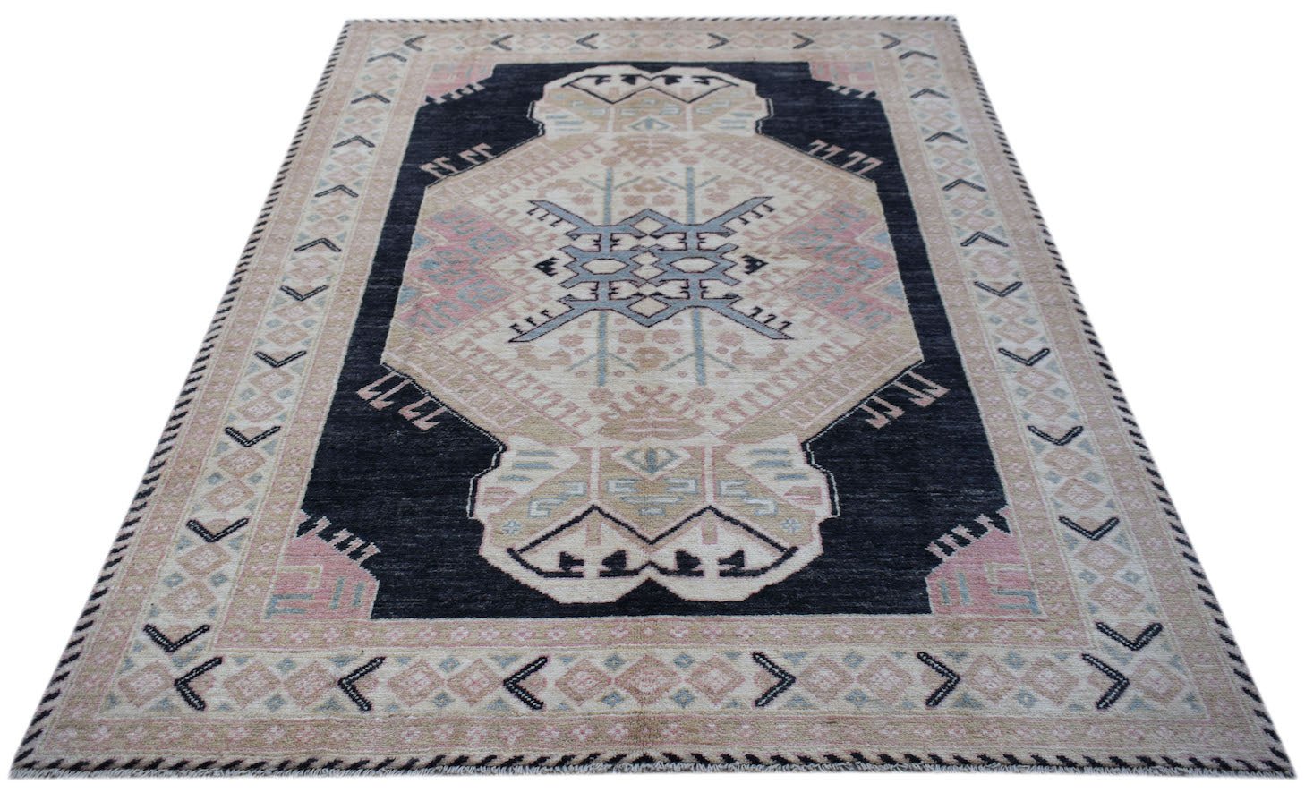 A handmade wool rug from Afghanistan featuring a central geometric medallion on a dark field.