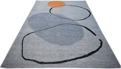 An Afghan Kohi rug featuring abstract black line art and blue shapes on a grey wool background.