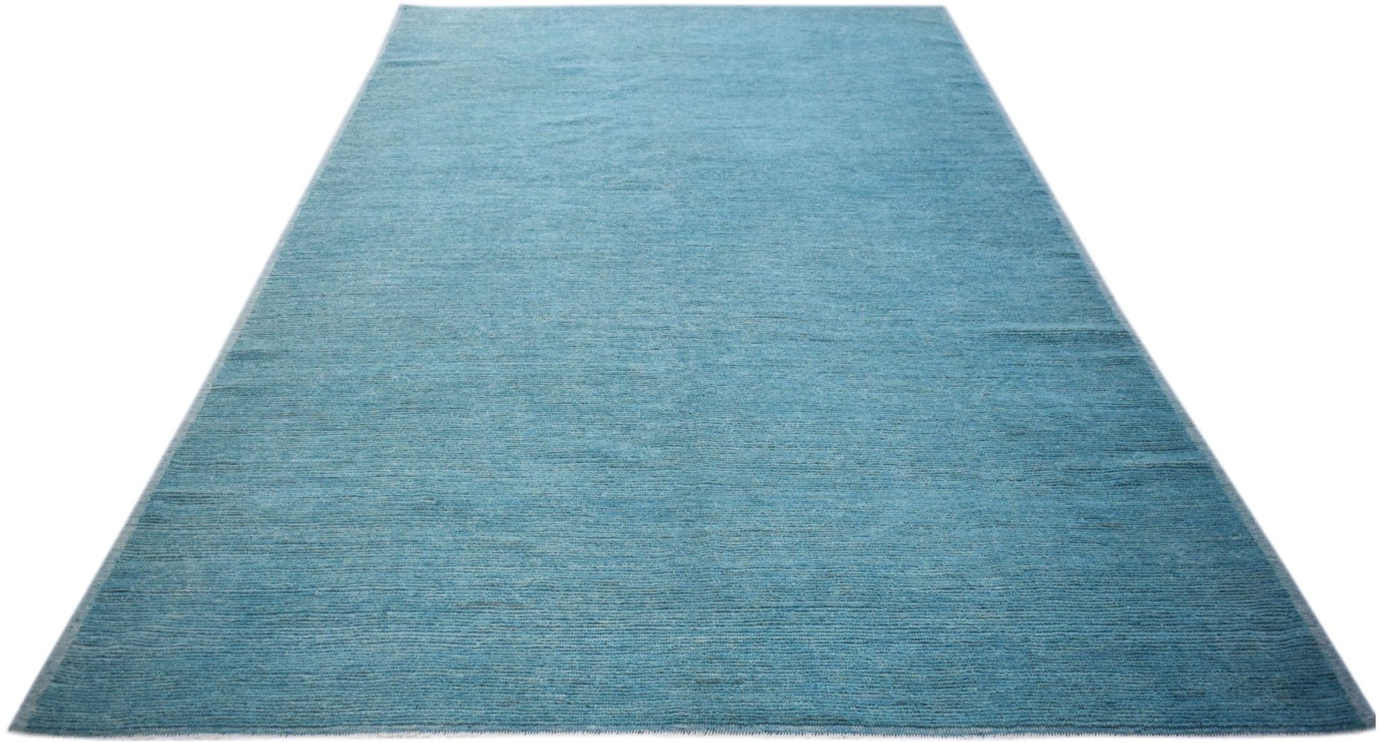 A rectangular, hand-knotted Afghan Kohi rug in a solid, textured blue wool.