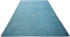 A rectangular, hand-knotted Afghan Kohi rug in a solid, textured blue wool.