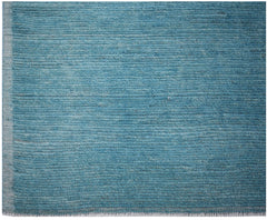 A hand-knotted Afghan Kohi rug featuring a solid, textured blue wool surface.