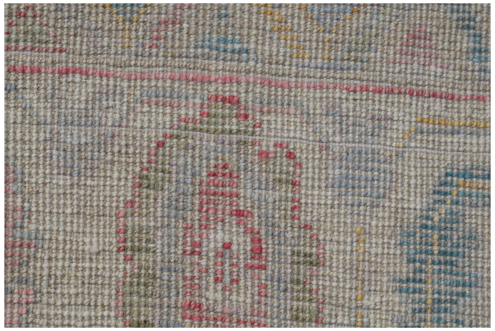 A handmade Afghan Oushak rug featuring a traditional pattern in soft, multicolored wool tones.