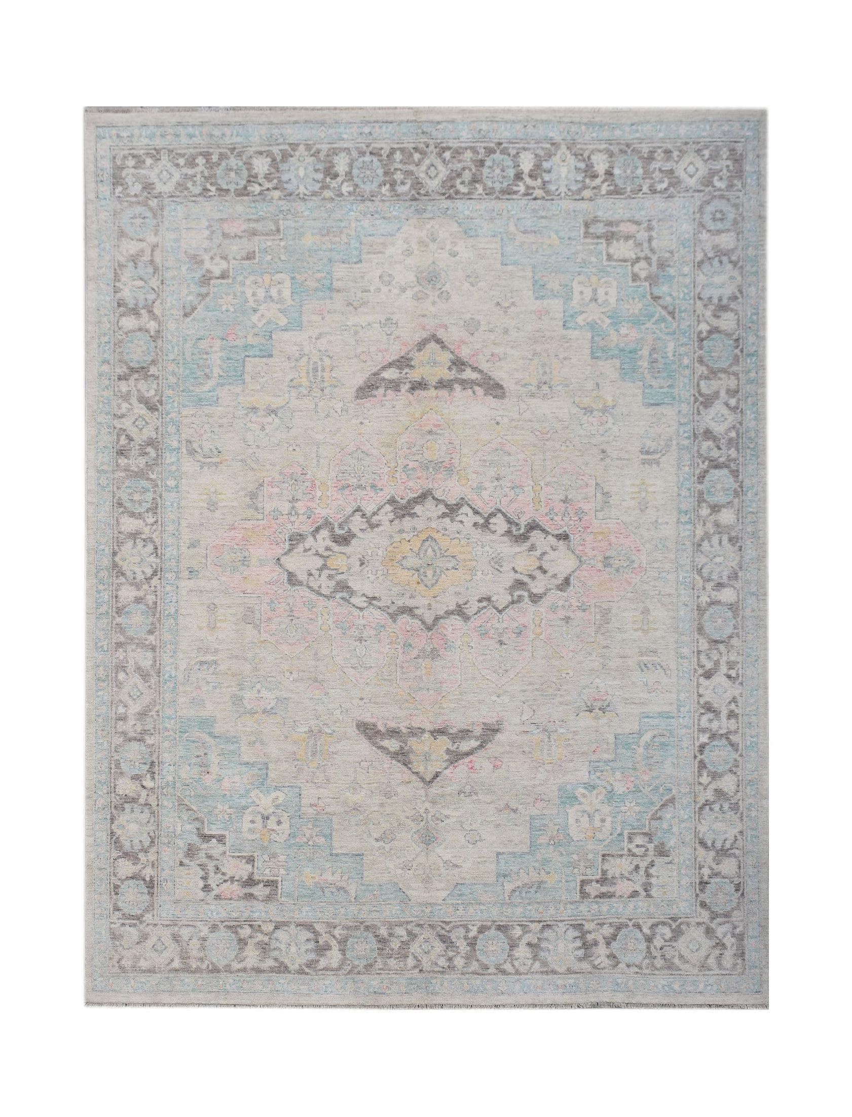 A handwoven transitional Oushak rug featuring a floral pattern in soft blue, pink, and grey tones.