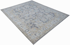 A handwoven transitional Oushak rug featuring a floral pattern in grey, blue, and beige tones.