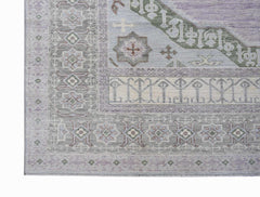 A handwoven transitional Oushak rug featuring a soft purple and grey floral pattern.