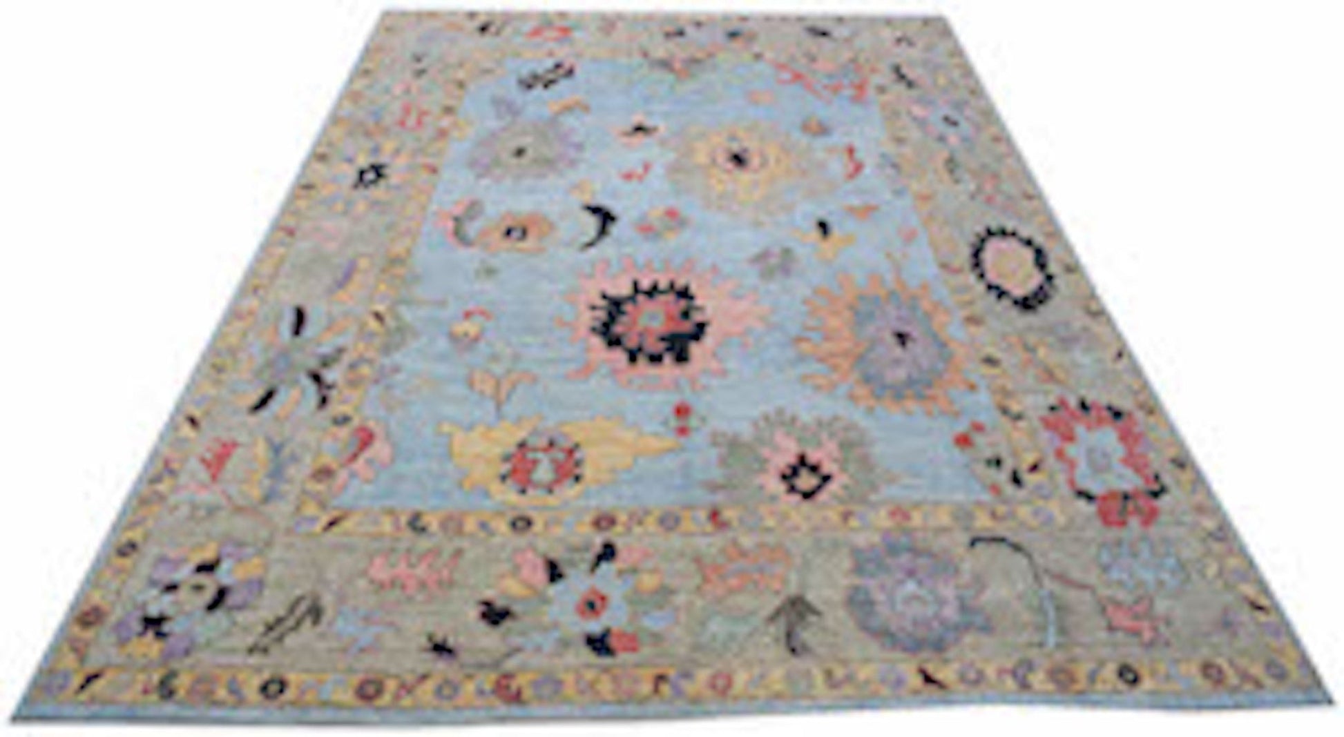 A handwoven transitional Oushak rug featuring a light blue field with colorful floral motifs.