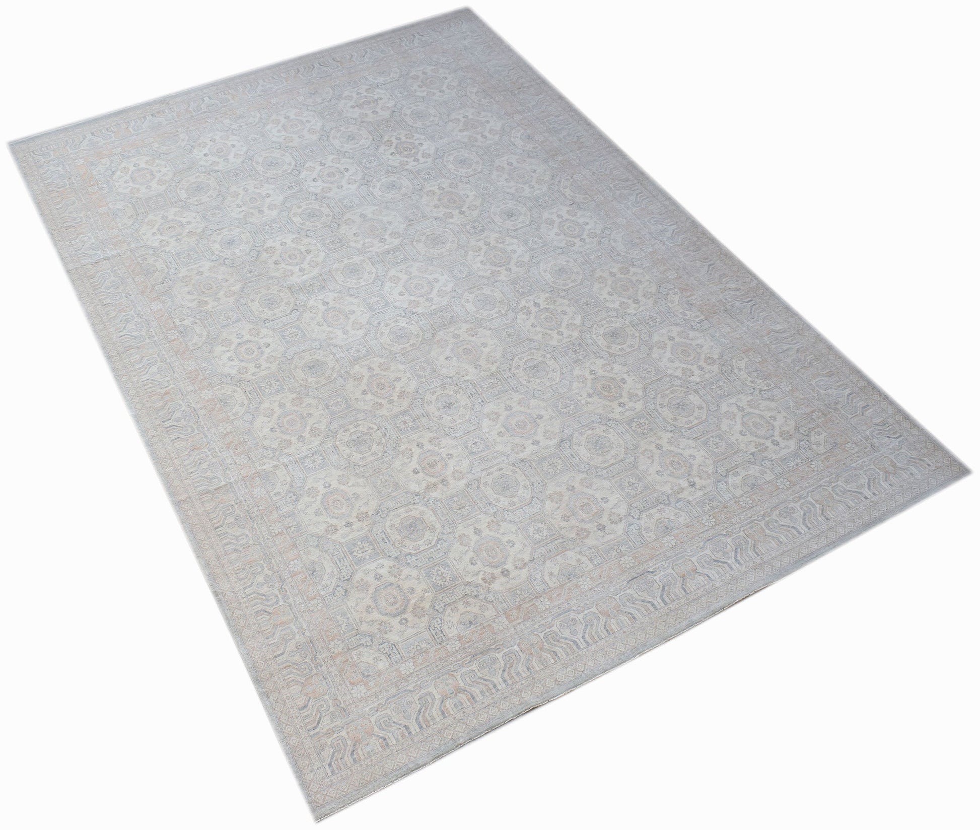 A handwoven transitional Oushak rug featuring a light floral pattern in soft neutral tones.