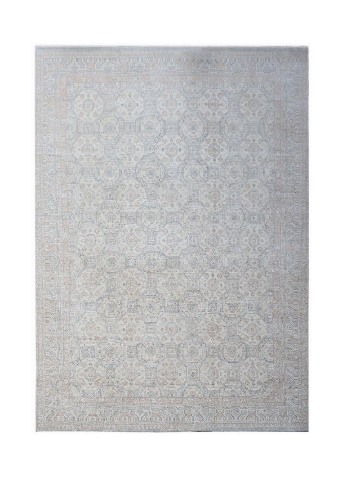 A handwoven transitional Oushak rug featuring a light grey floral pattern on a wool pile.