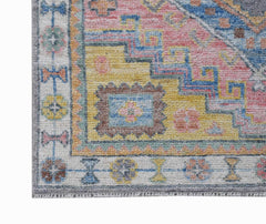 A handwoven transitional Oushak runner featuring a colorful floral pattern on a yellow background.