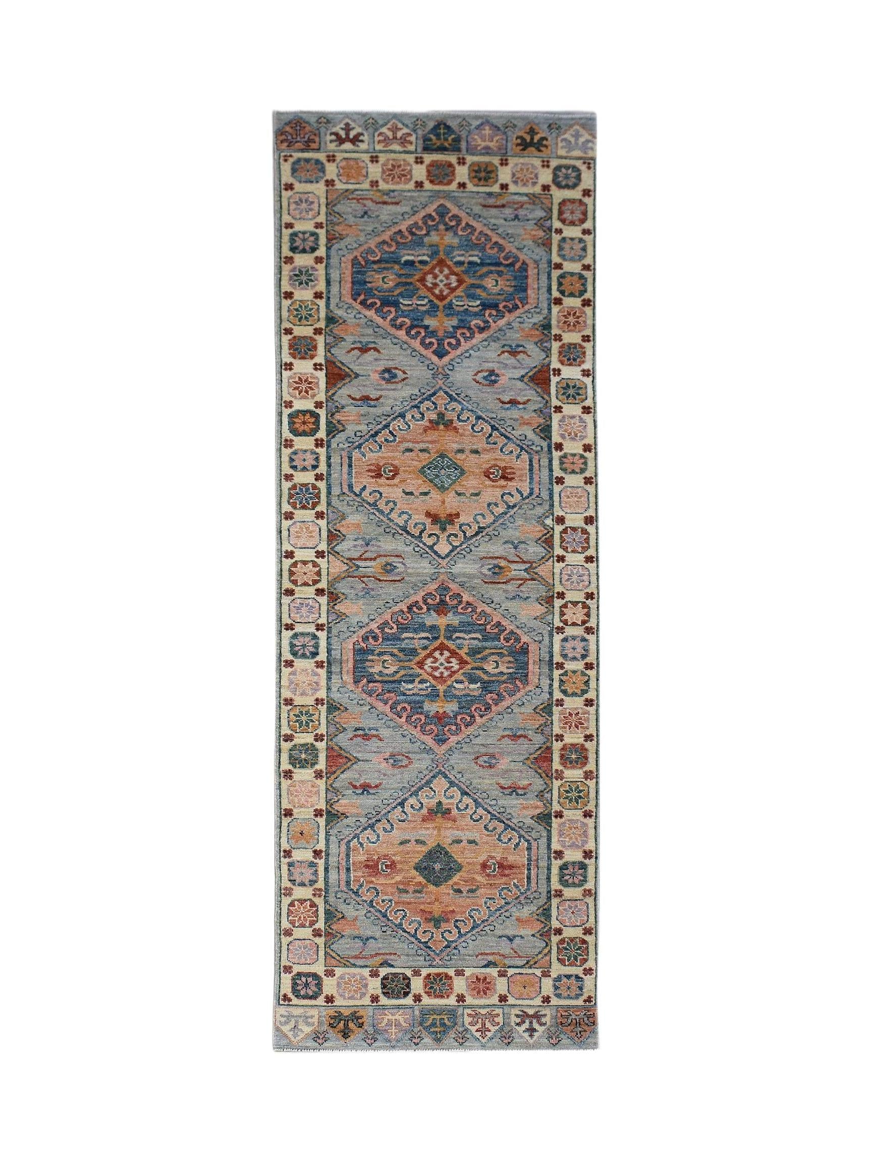 A handwoven transitional Oushak runner featuring a blue and peach geometric pattern.