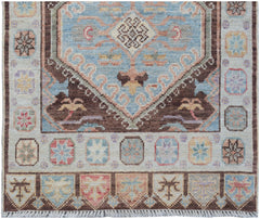 Handmade Afghan Oushak runner featuring a traditional geometric pattern in blue and brown tones.