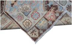 A handmade Afghan Oushak runner featuring a traditional geometric pattern in soft pastel tones.