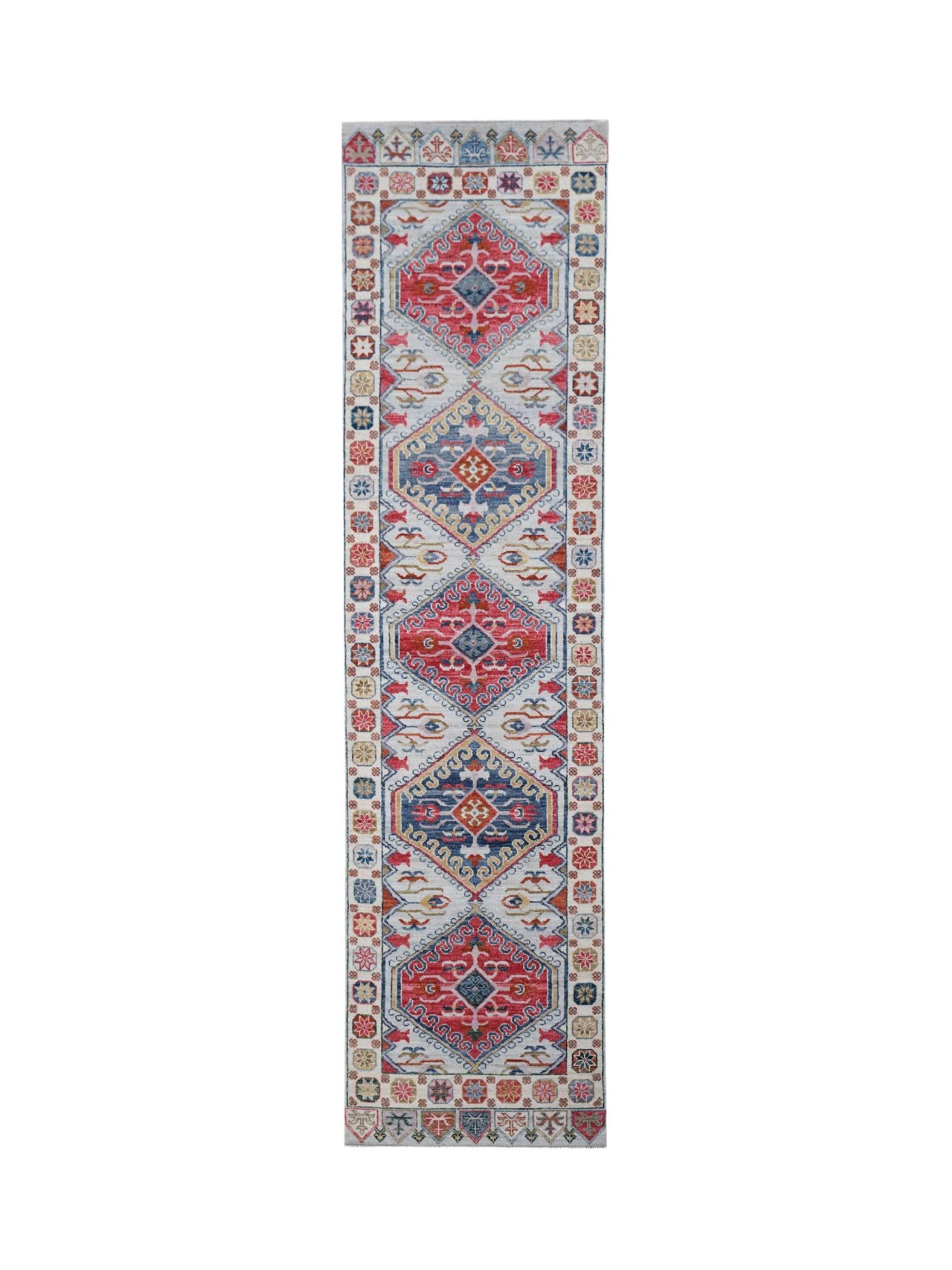 A handwoven transitional Oushak runner featuring a repeating geometric pattern in red and blue.