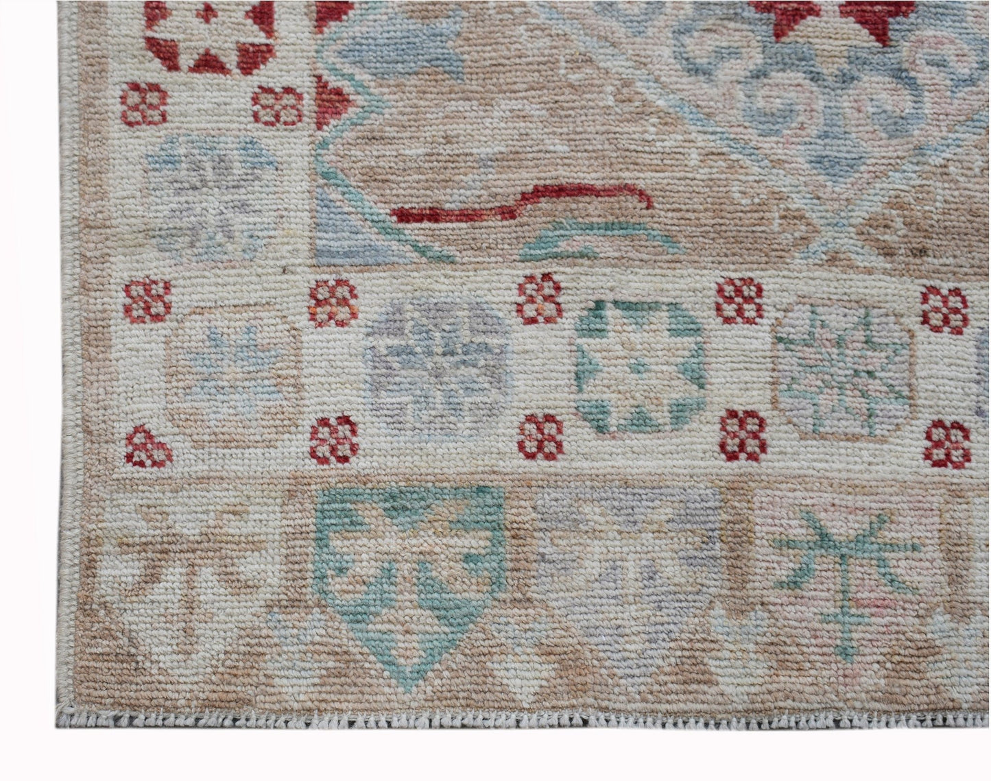 A handwoven transitional Oushak runner featuring a geometric floral pattern in muted tones.