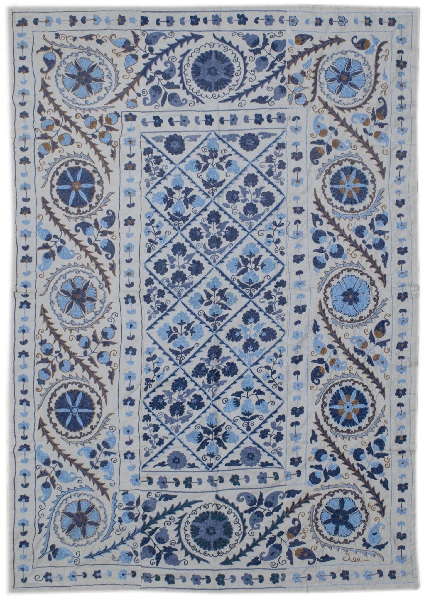 Hand-embroidered Uzbek Suzani textile featuring blue floral and geometric motifs on a cotton base.