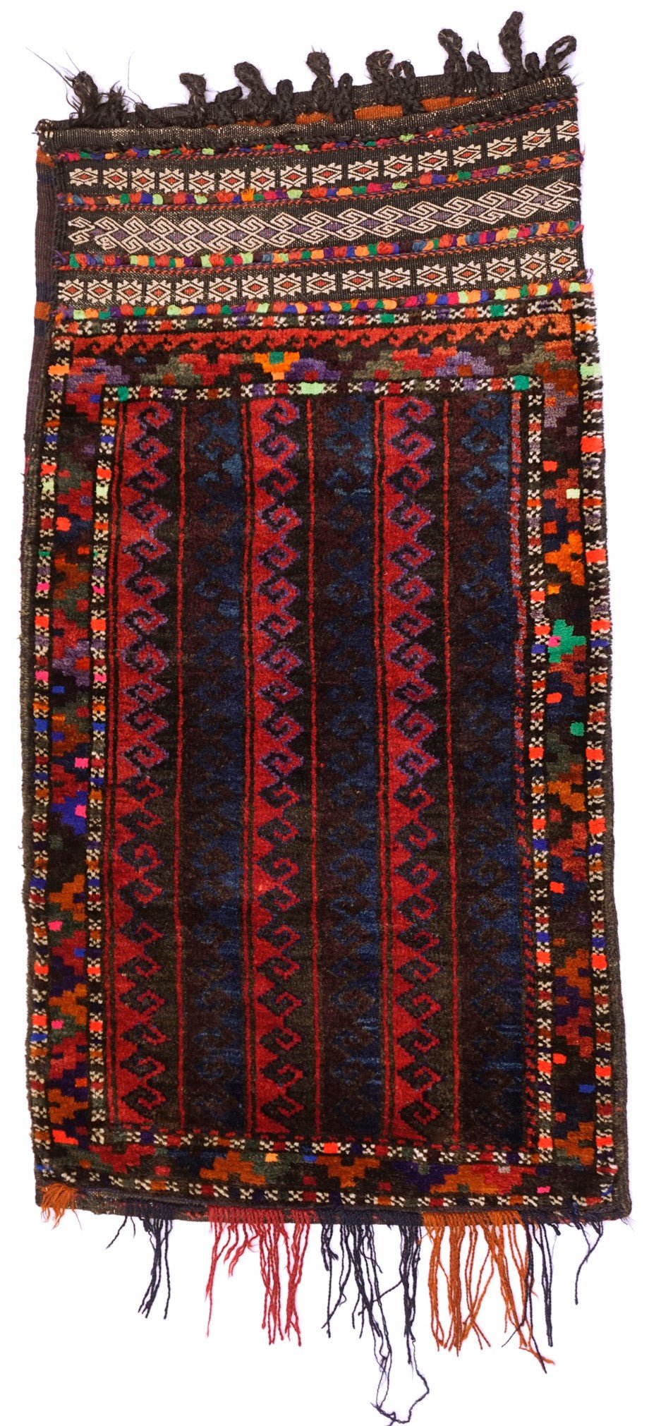 A handmade vintage Afghan Baluch wool cushion featuring geometric patterns and a fringed edge.