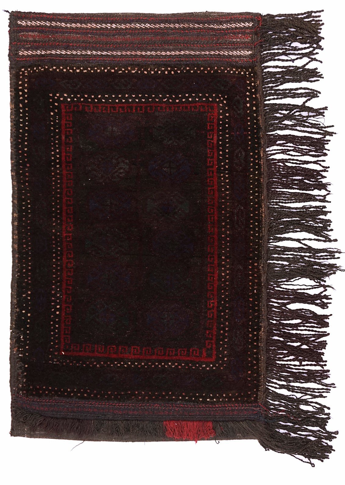 A handmade vintage Afghan Baluch wool cushion featuring a dark geometric pattern and fringe.