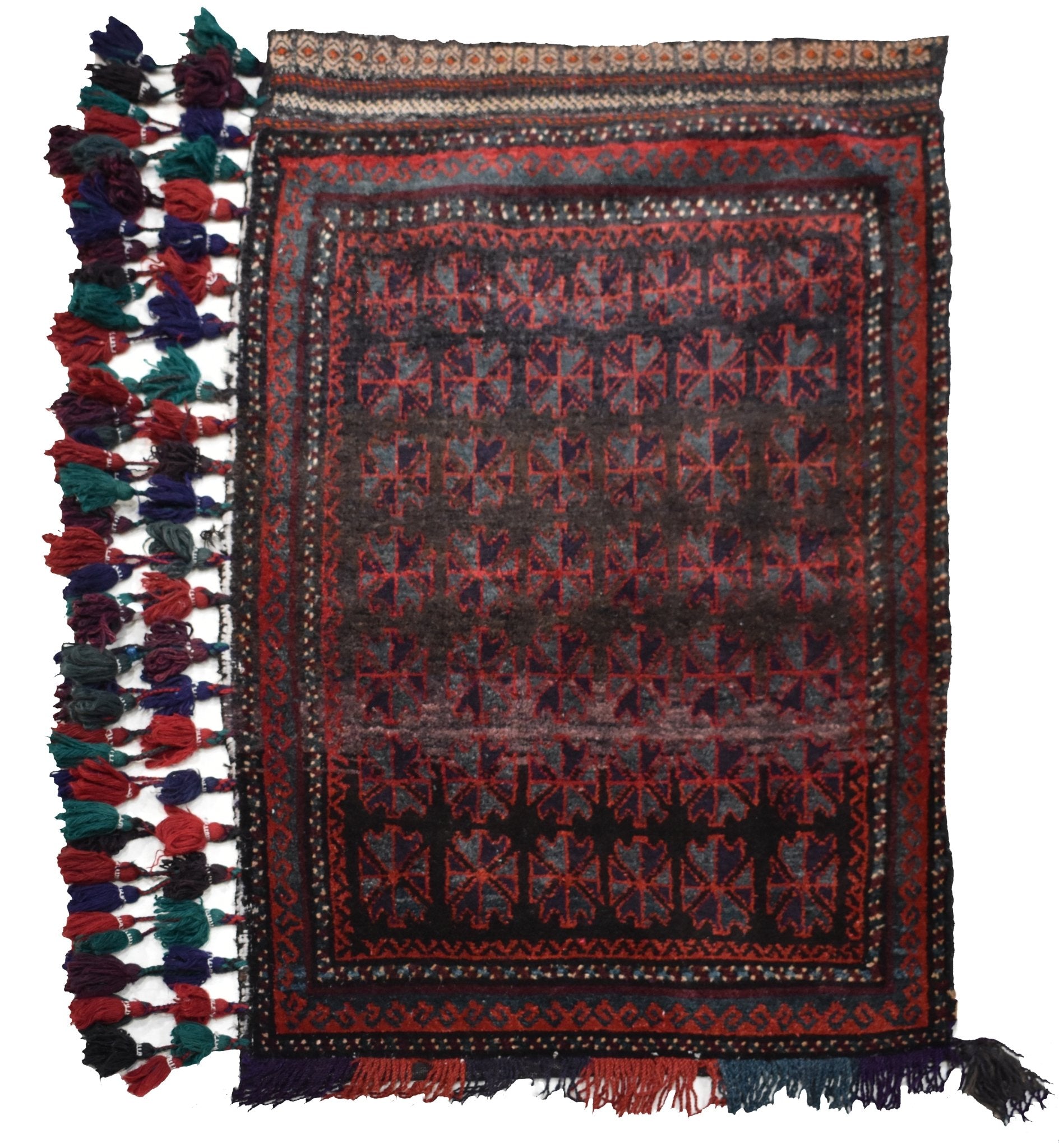 A vintage handmade Afghan Baluch wool rug featuring a repeating geometric pattern and tassels.