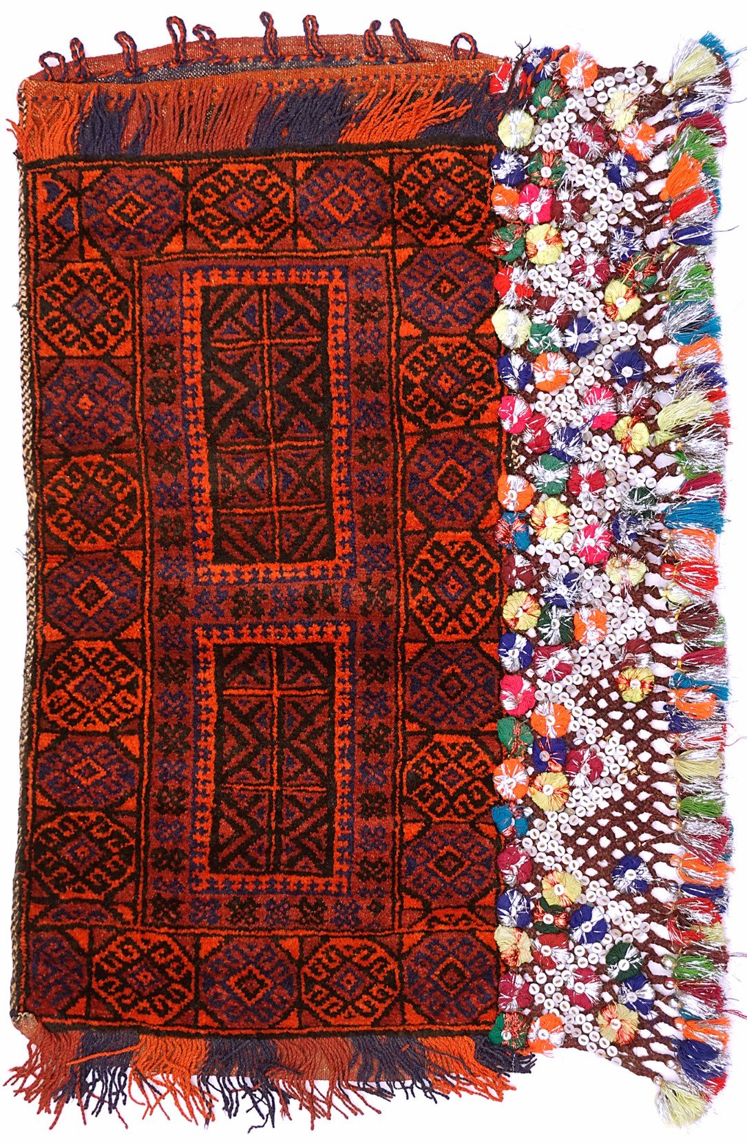 A handmade vintage Afghan Baluch wool cushion featuring geometric patterns and decorative tassels.