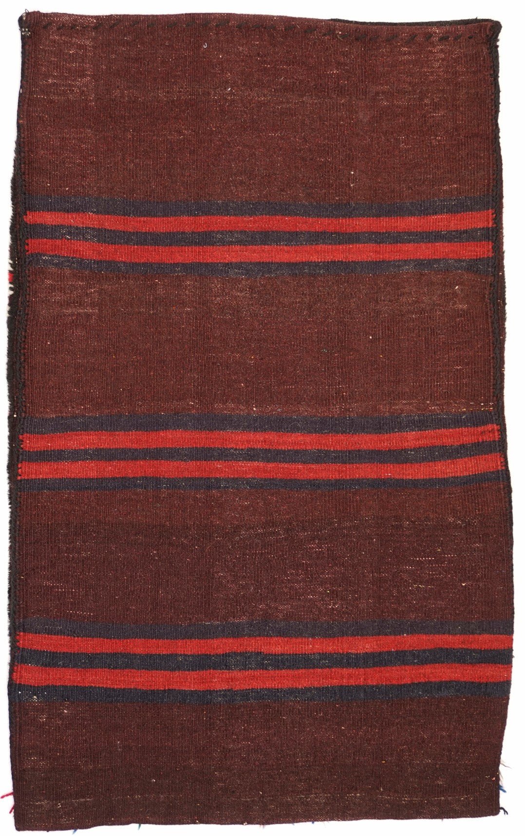 A rectangular vintage Afghan Baluch cushion featuring horizontal dark brown and red stripes.
