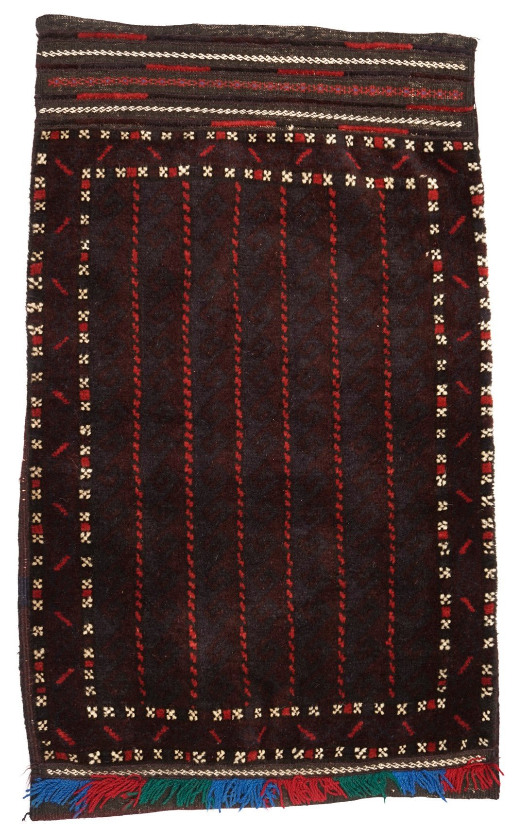 A handmade vintage Afghan Baluch wool cushion featuring a dark geometric pattern and fringe.