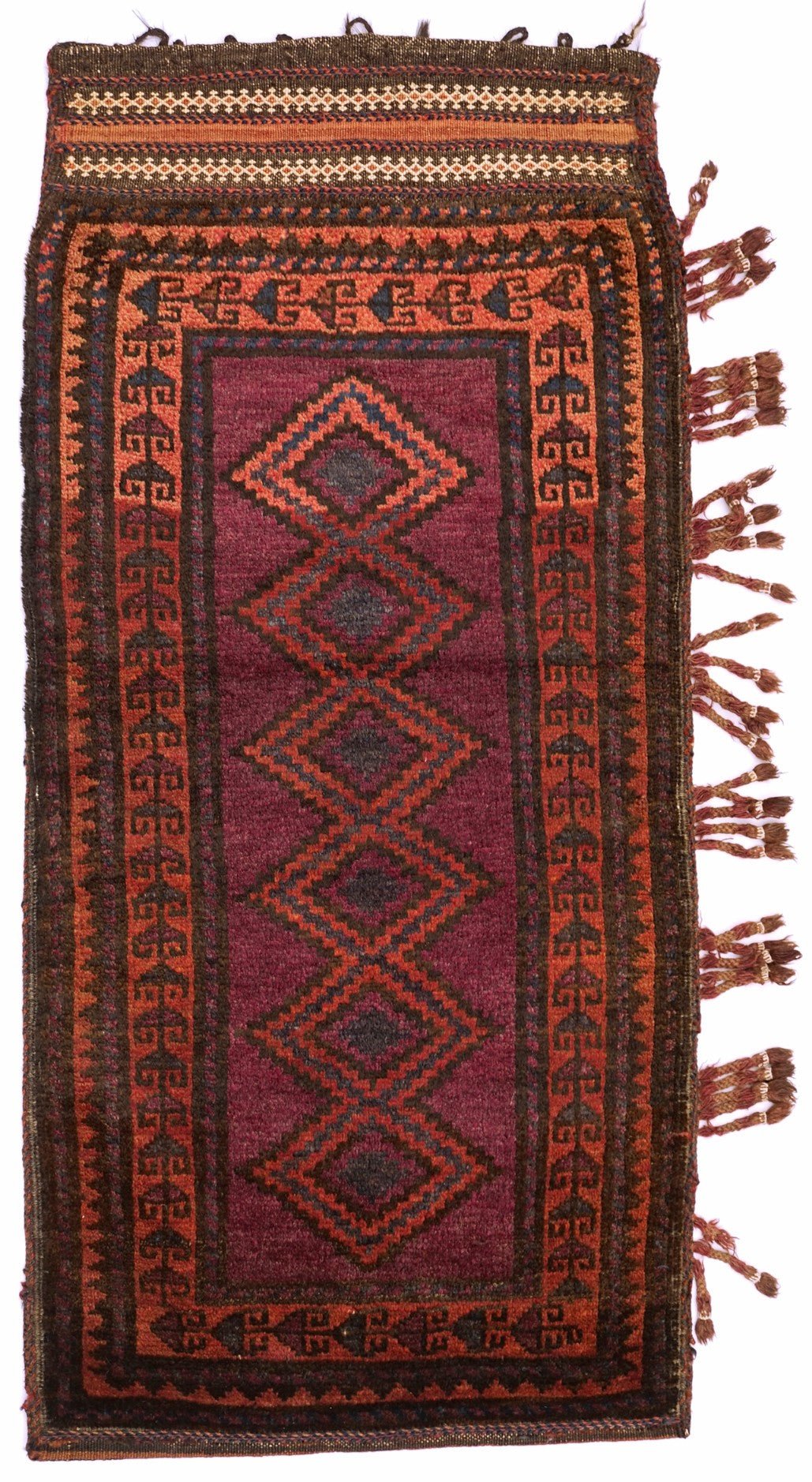 A handmade vintage Afghan Baluch wool cushion featuring a deep red field with diamond patterns.