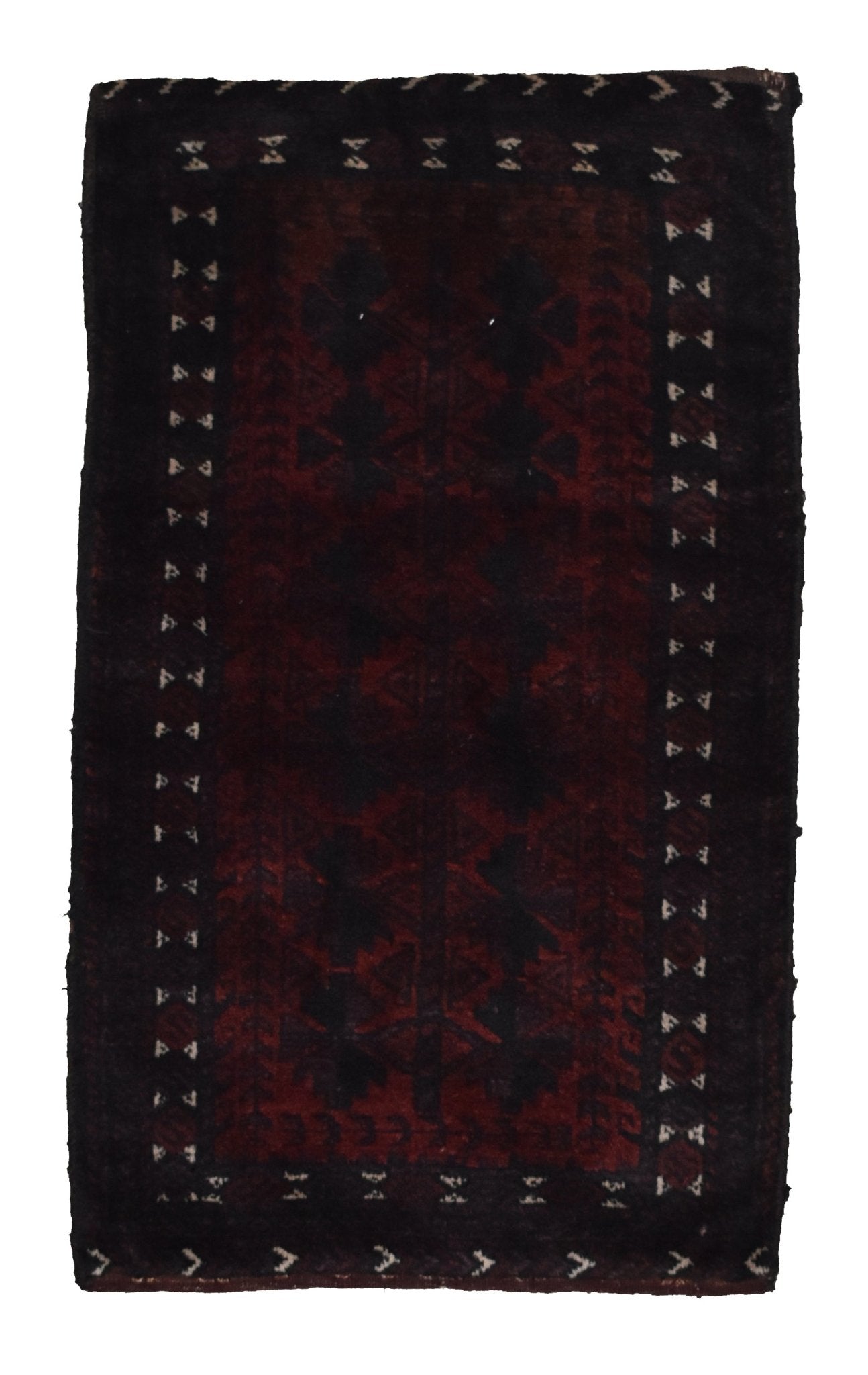 A rectangular vintage Afghan Baluch wool cushion featuring a dark red and black tribal pattern.