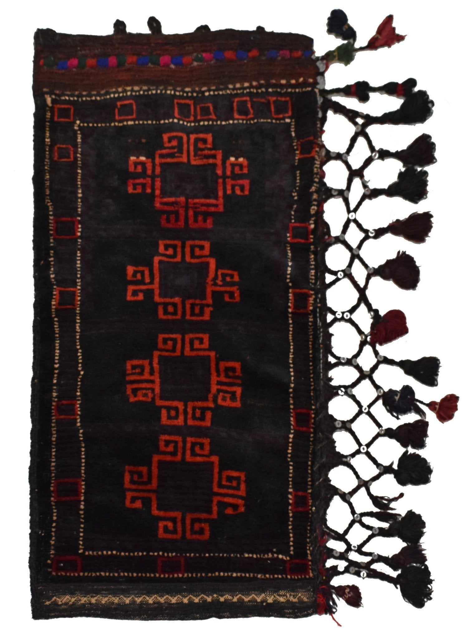 A vintage Afghan Baluch cushion featuring red geometric motifs on a dark wool background.