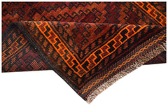 A vintage Afghan Baluch rug with a geometric pattern in shades of red, orange, and black.