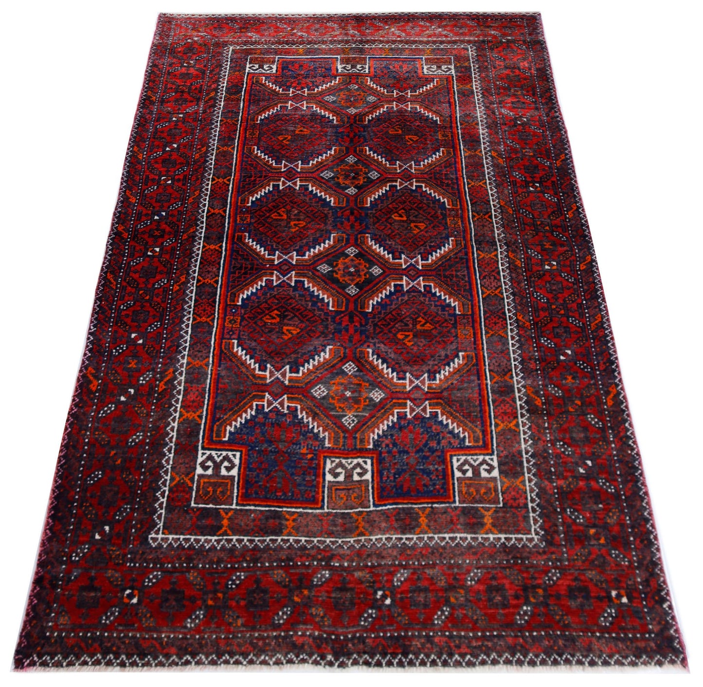 A vintage handmade Afghan Baluch rug featuring geometric patterns in deep red and blue tones.